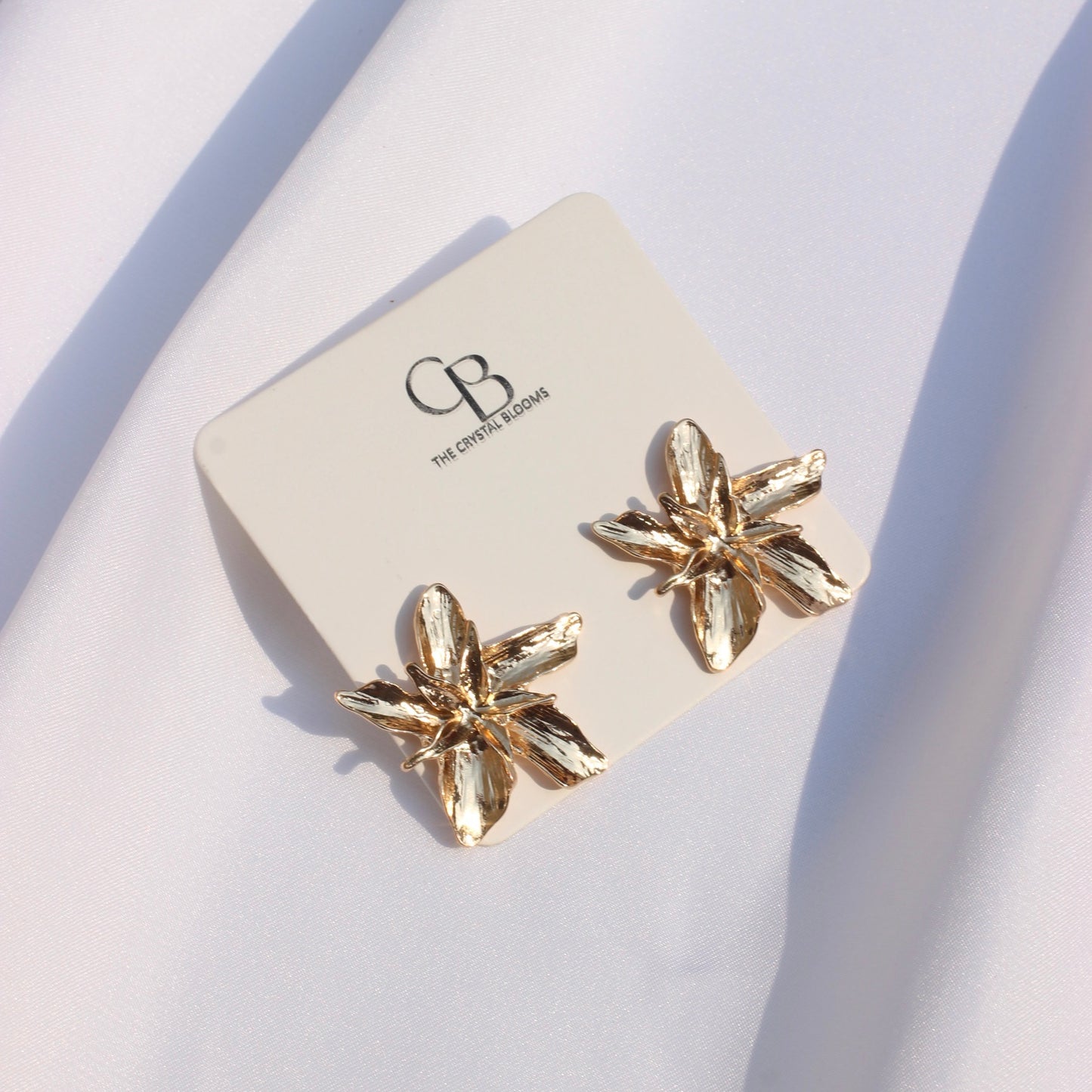 JEarrings gold statements flower studs-26